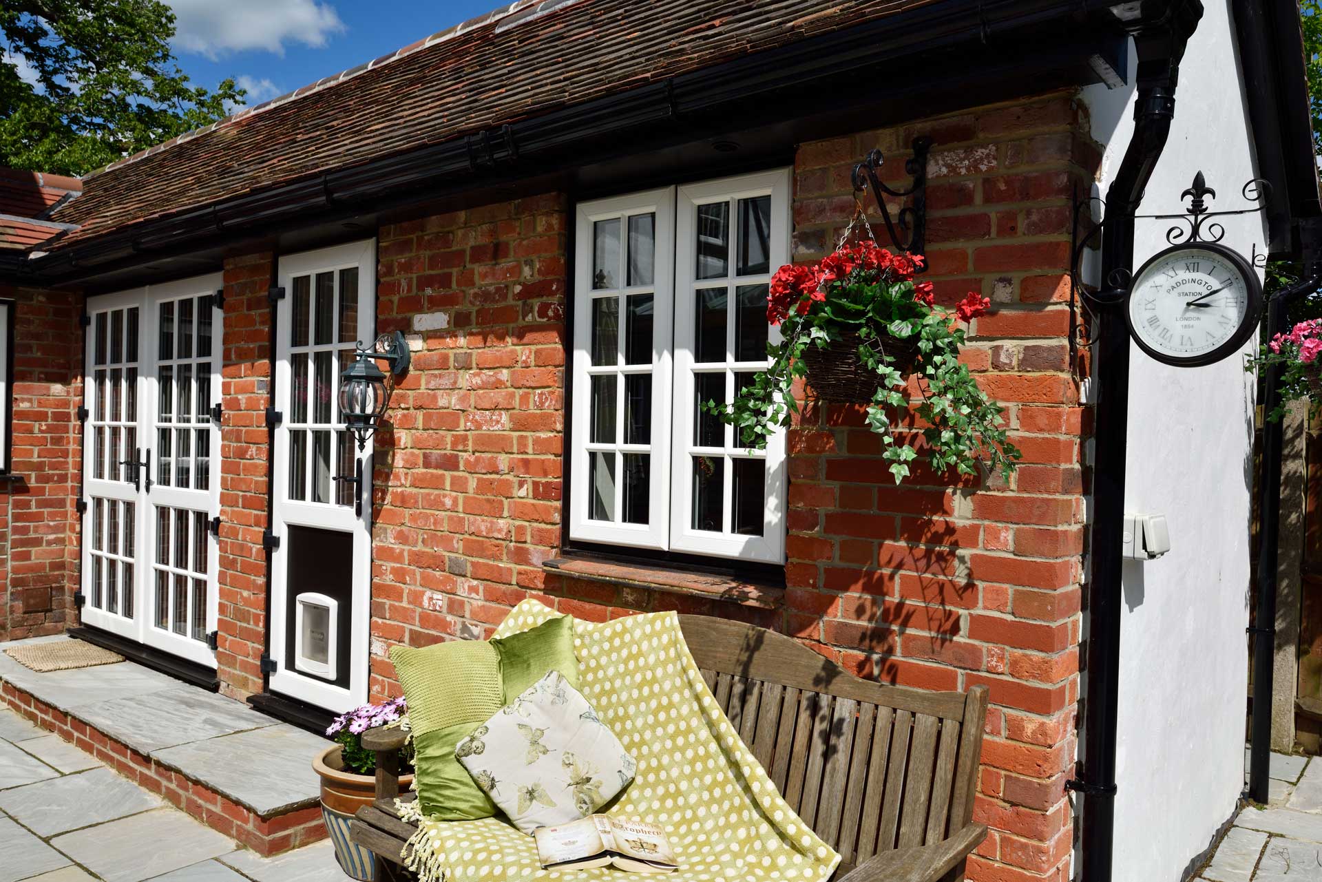 White uPVC door on red brick building